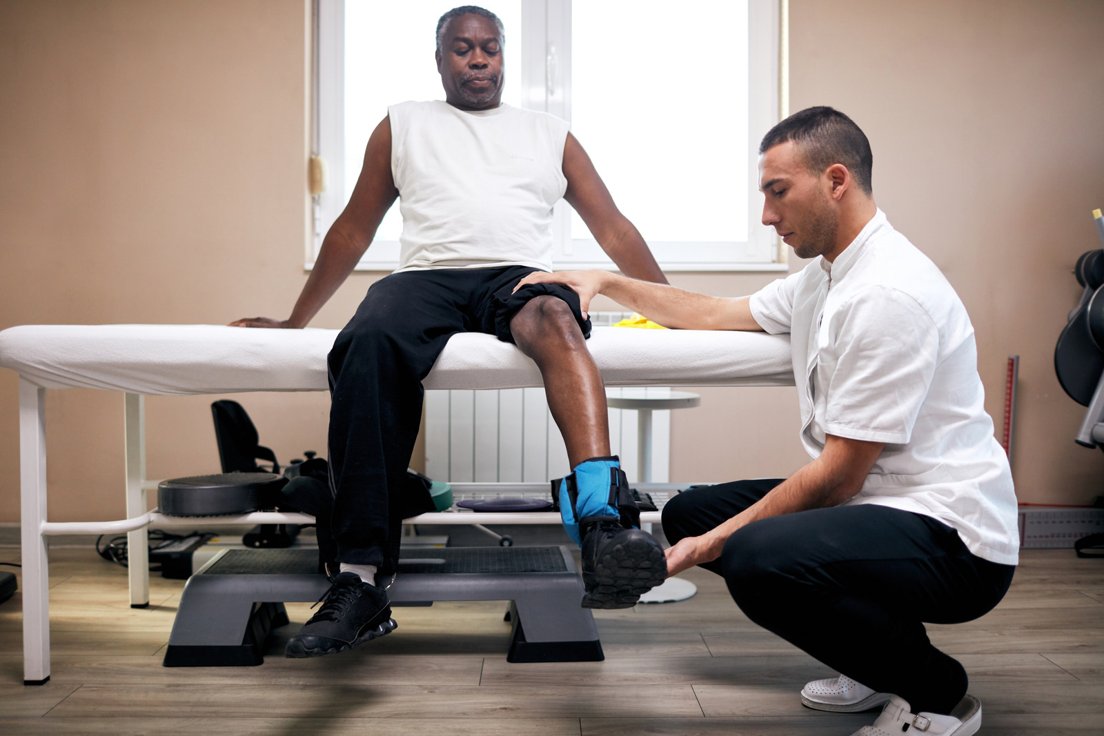 Senior man at physical therapy with therapist for driver health and fitness